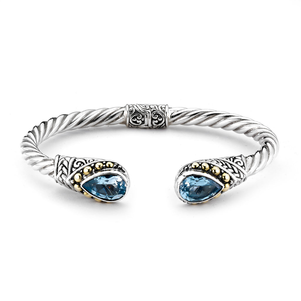SS/18K TWISTED HINGED CABLE BANGLE W/ BLUE TOPAZ PEAR CUT EN