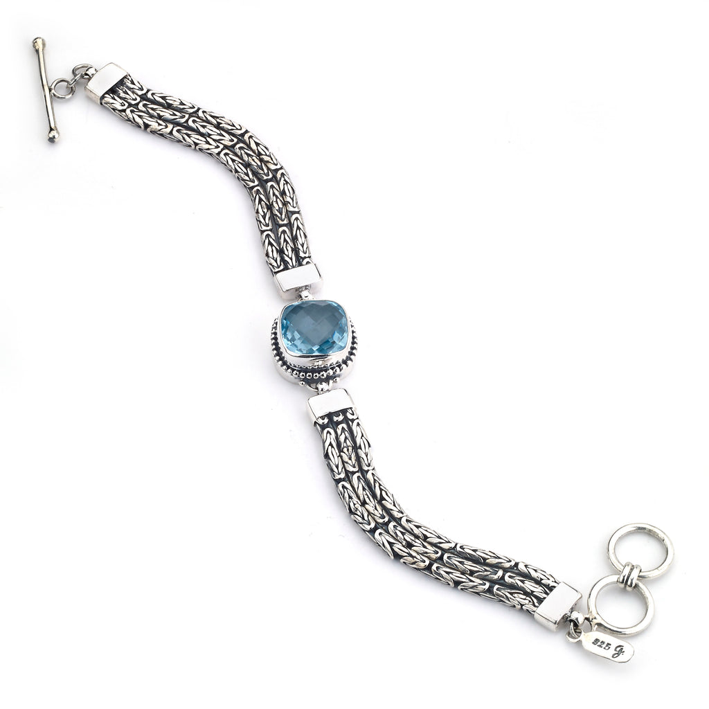 SS FACETED BLUE TOPAZ CUSHION CENTER BRACELET