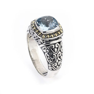 SS/18K RING W/ BLUE TOPAZ AND SWIRL DESIGN