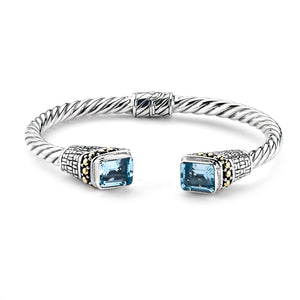 SS/18K TWISTED EMERALD CUT BLUE TOPAZ HINGED BANGLE