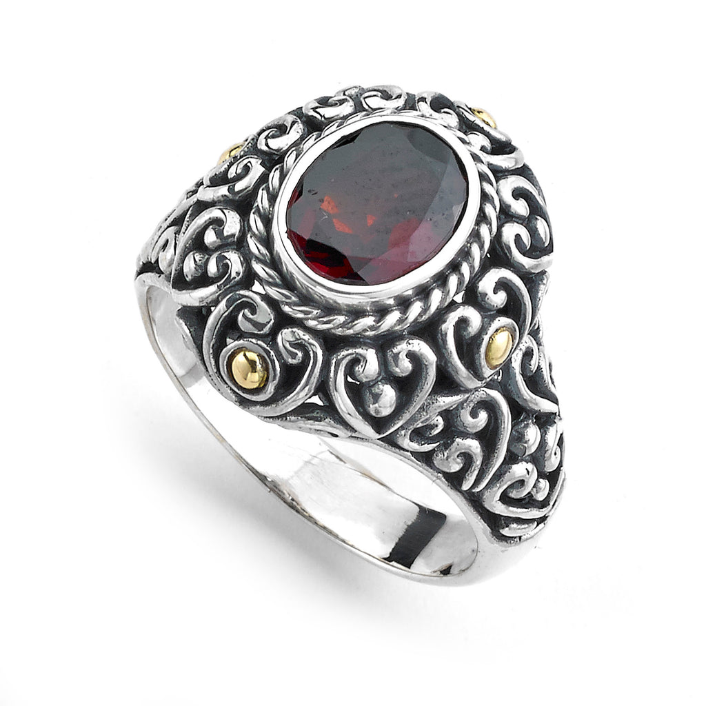 SS/18K 7X9 OVAL CUT GARNET RING