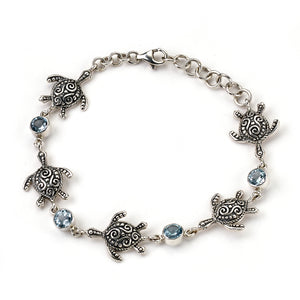 SS TURTLE & ROUND BLUE TOPAZ STATION BRACELET